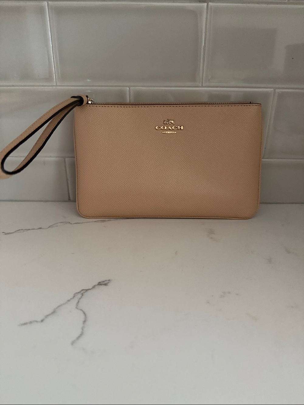 Coach Tan Pebbled Leather Wristlet with Gold Logo